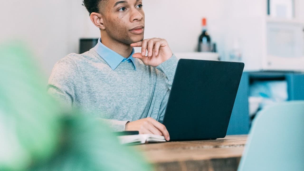 A participant working on a laptop
